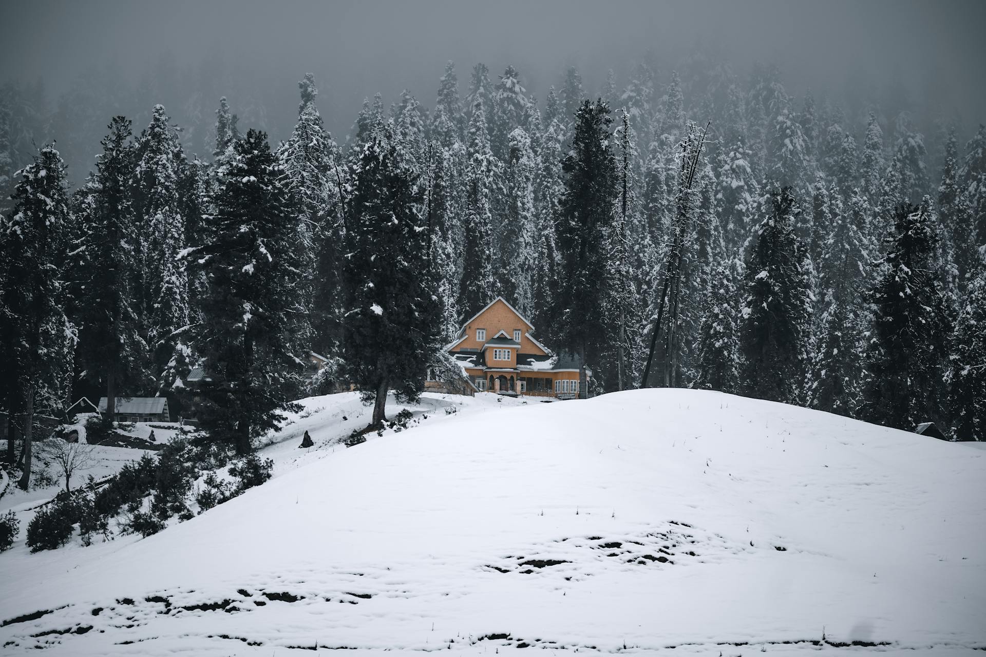 Gulmarg covered in snow with a hill station